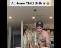 Girl births black labrador dog red collar 