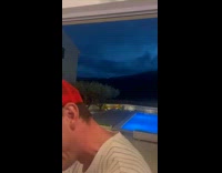 Man points to sky then lightning strikes