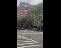 2 guys throw football in middle of street 
