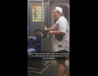 Guy plays ACDC song to help wake up man passed out on subway train