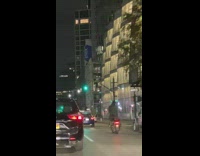 Guy stands on motorcycle seat and dances 