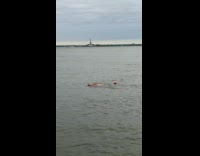 Guy swims with buoy attached to himself