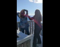 Woman in a blue jacket poses at the stairs