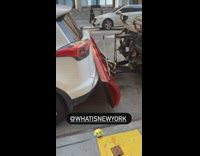 White car stuck between suv and snow plow