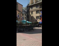 Woman black long sleeves slow walk drink