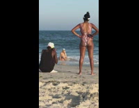 Woman blue bikini fishermans hat fix bra