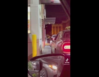 Fast food drive thru rage fight mop hits car