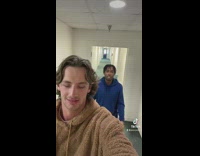 Guy closing eyes guesses friends finger numbers 