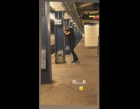 Guy pretends to chokehold somebody at subway station