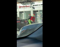 The Grinch rides motorcycle after stealing gifts