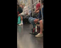 Man has white face paint with white flower headband on his head