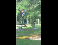 Blue dress girl balloons empty park table 