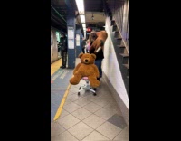 Woman moves stuffed animals walks at platform