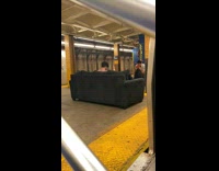Guy sit pose on sofa subway platform