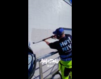 Man paints wall and fills blank space