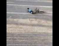 Guy tries to jump stairs on bike fail