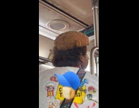Collab WINY - Man wears bread bun hat ride subway