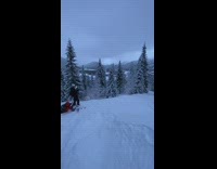 Guy in yellow jacket flies off ski jump