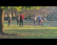 People Do Random Dance on Open Grass