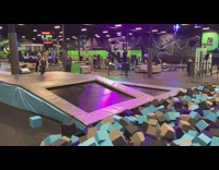 Little boy jumps off trampoline but misses foam pit, face plants into safety pad