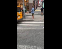 Man wears suit with shorts and slippers