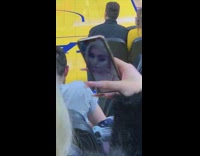 Woman takes selfie at a basketball game