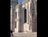 Woman dances with kangaroo shoes in front of the cathedral