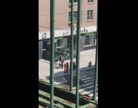 Guy bird costume mask bicycle sidewalk 