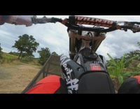 Guy jumps over metal ramp red pants