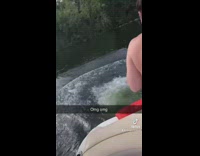 Girl jumps off boat to retrieve fallen phone 