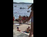 Man large knife group woman bikini photo shoot