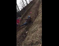 Woman races in pink toy car, crashes into haystack and rolls down hill 