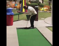Grandpa hits a hole in one at a mini gold course and jumps into the fountain pool
