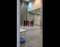 Collab IITW - Five employees in uniform dances at event