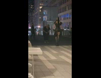 Woman in black leather outfit large heels