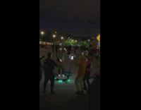 Man jumps for a dance video shoot at the park