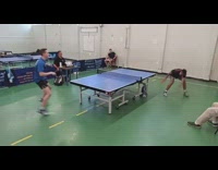 Two guys play ping pong tournament game 