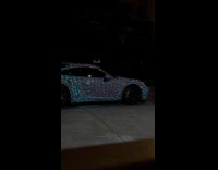 Sports car glows wrapped with Christmas Lights
