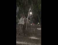 Man drink from water fountain couple flirt