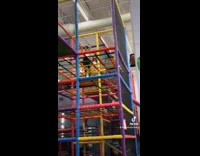 Kid pushes mom while she ties her hair 