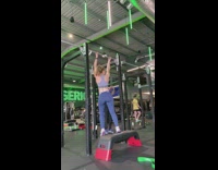 Woman stands on resistance belt at gym 