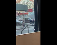 Woman taking pictures pretending to cross street