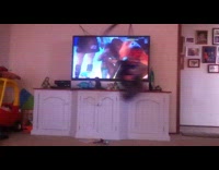 Boy swings around inside house like spiderman