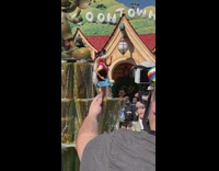 Guy takes picture of Barbie with Disney ears