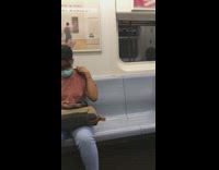 Lady wearing swim goggles rides subway train 