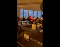 Santa eats with elf at restaurant 