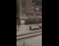 Snowball fight between two groups at street