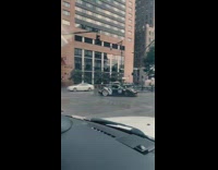 Black car spins drives away street road 