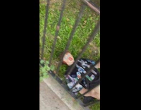 Blowup doll wearing sweater on grass