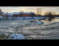 Frozen river water causes flood upstream 